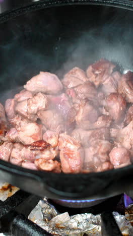 cooking meat in a wok