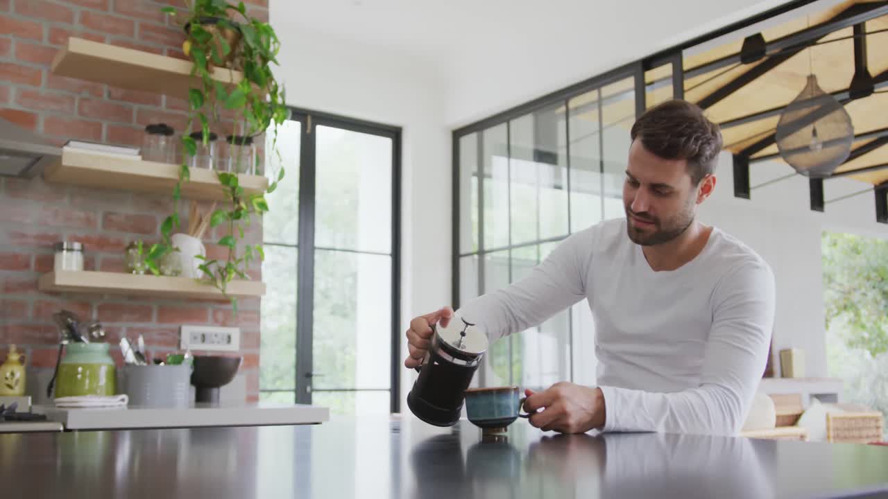 Man pouring coffee in coffee cup at dining table in a comfortable home 4k