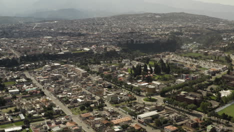 aerial view of a sprawling city with mountains in the background