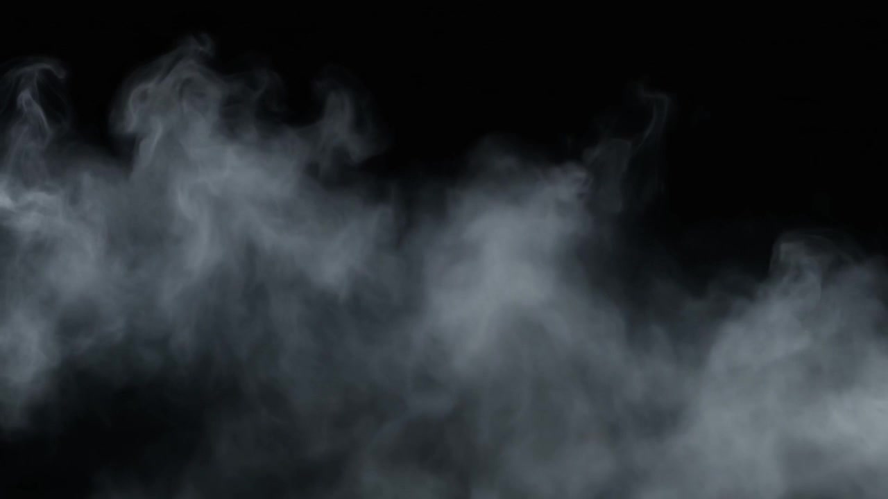Humo blanco elevándose contra un fondo negro