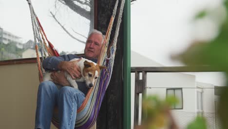 senior man and his dog at home