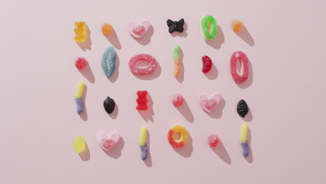 video of colourful jelly candy on pink background