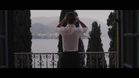 man on a balcony with a view