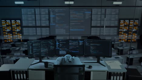back view of tired asian man developer sleeping while write code with multiple computer screens in the office