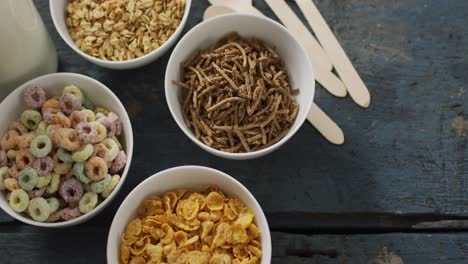 video of cereals in ceramic bowls on wooden kitchen worktop