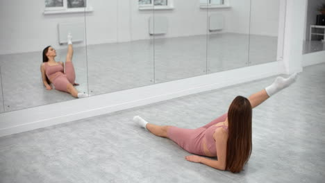 woman stretching in a dance studio