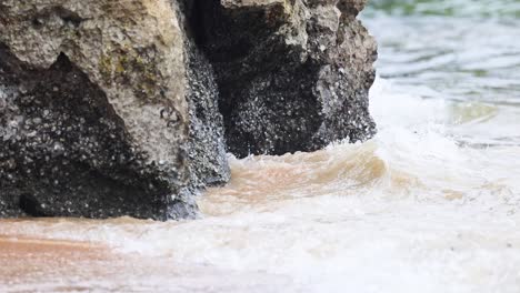 waves hitting rocks at ao nang beach