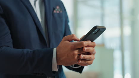 businessman texting on smartphone