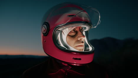 astronaut man with helmet explores a desolate planet at night in mountain