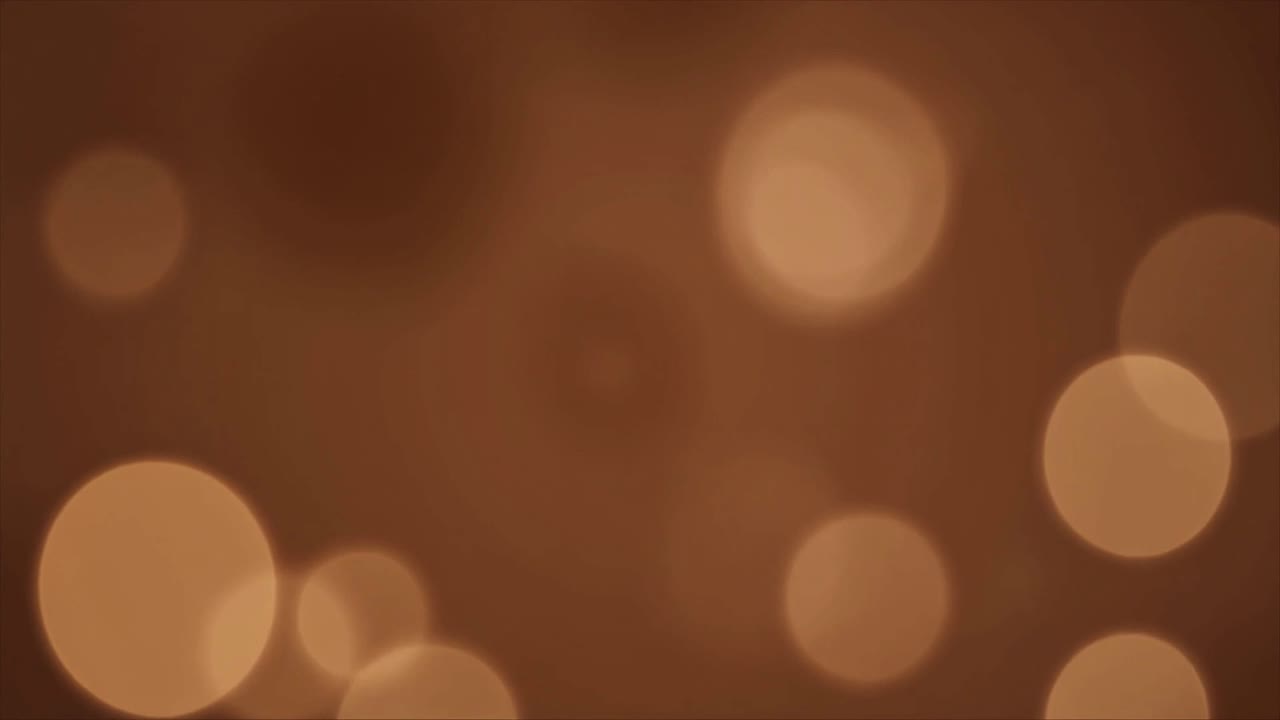 Sfondo astratto in movimento con luci bokeh marroni calde