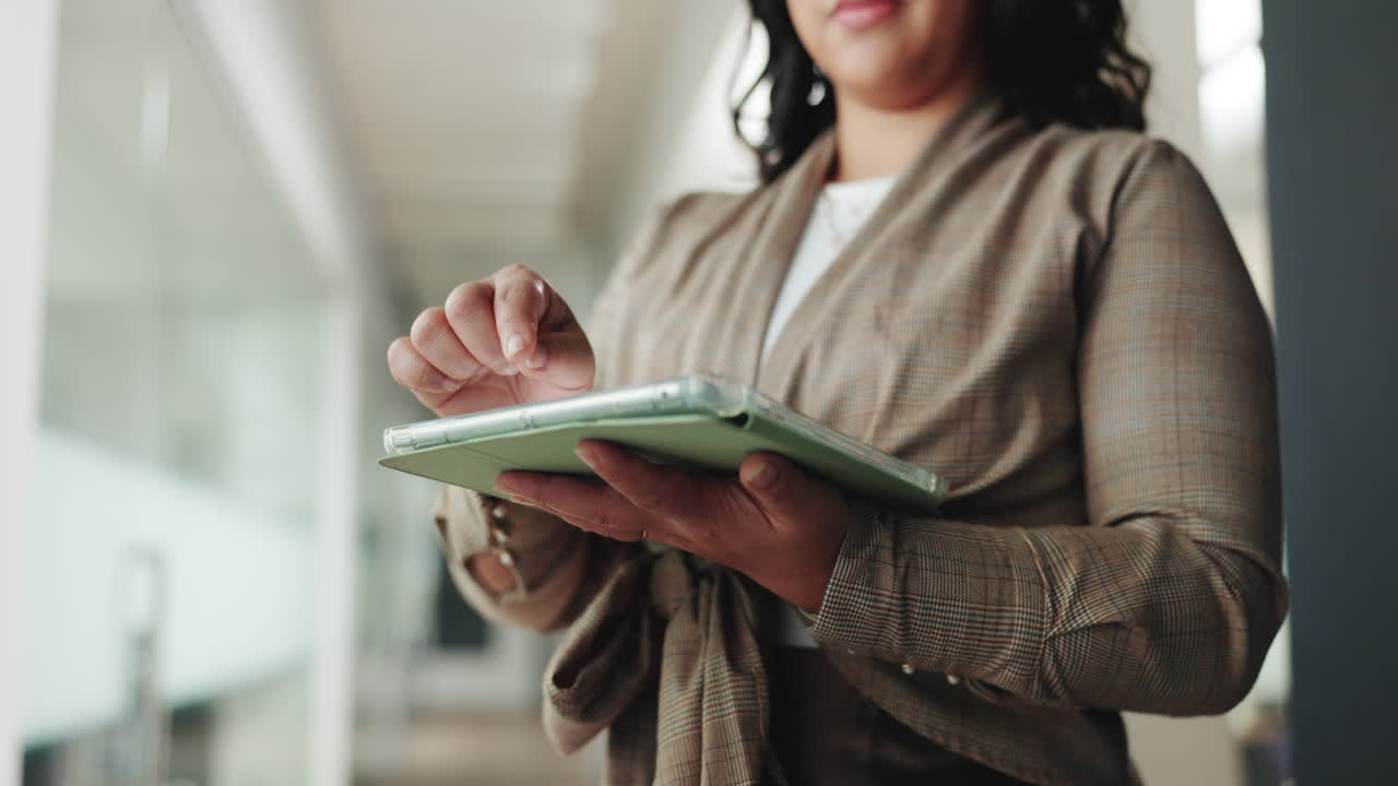 Woman's Hands Using Digital Tablet in Modern Office