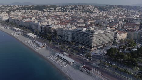 aerial view in french riviera with people on the beach in nice during summer day
long travelling drone shot to top shot in the french riviera during summer
lot of people on the beach and swimming