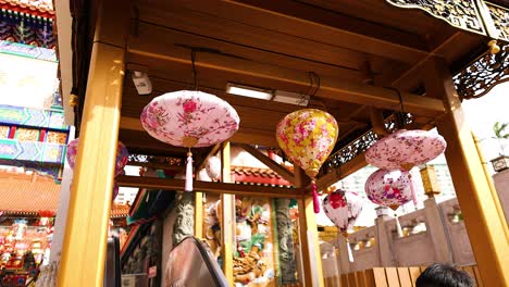 colorful lanterns hanging in temple setting