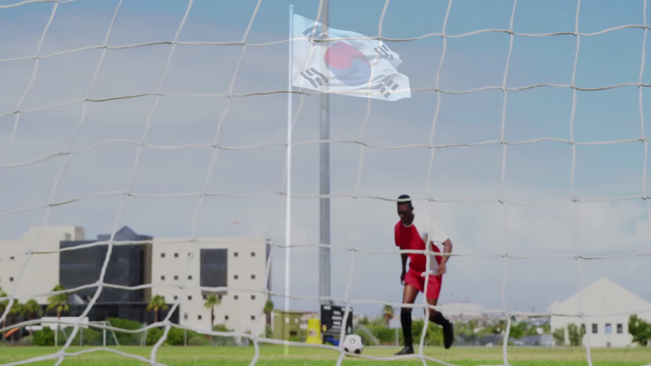 In animation, soccer player in red uniform near goalpost with South Korean flag