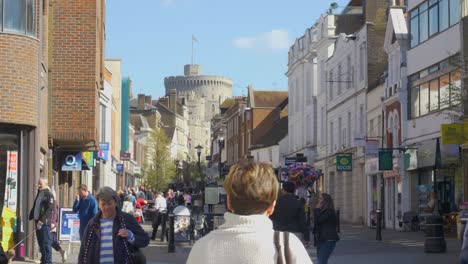 shoppers walking on peascod street windsor, united kingdom on a clear spring day in march