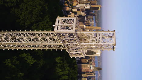 vertical aerial view around the mount royal cross, sunset in montreal, canada