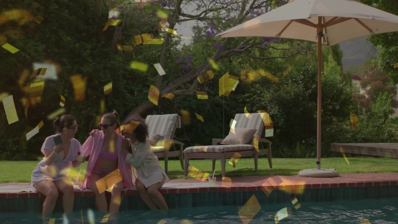 Taking selfie one friend holding phone sparking gold confetti three friends posing laughing kissing
