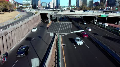 drone backwards solar panels mexico city driveway daylight