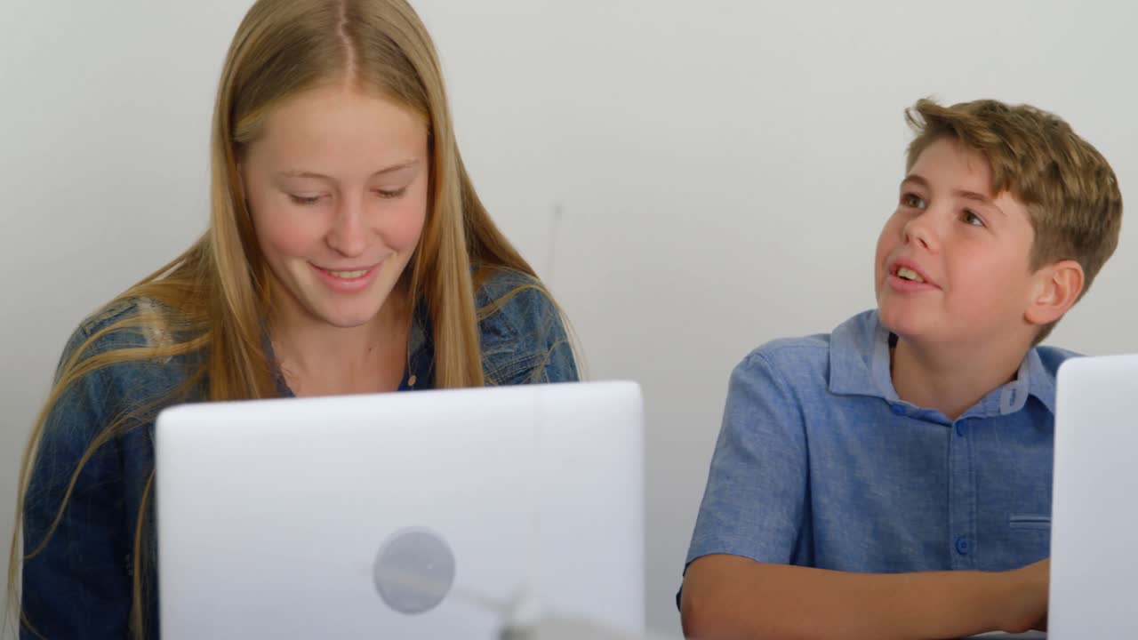 Kids using laptop in training institute 4k