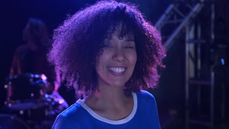 Female-musician-looking-at-camera-and-smiling