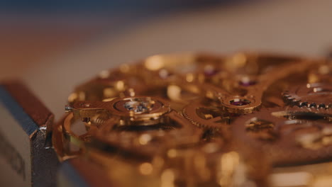 watchmaker used tweezers to remove ruby jewel on a balance wheel in a mechanical watch