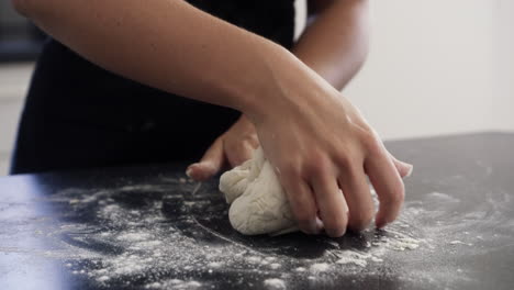 woman kneading dough