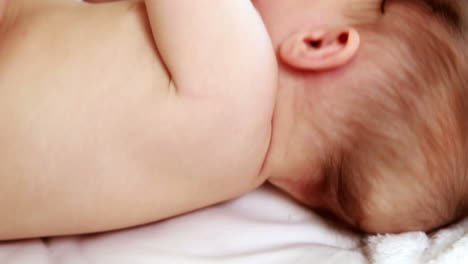 adorable baby boy lying in his crib