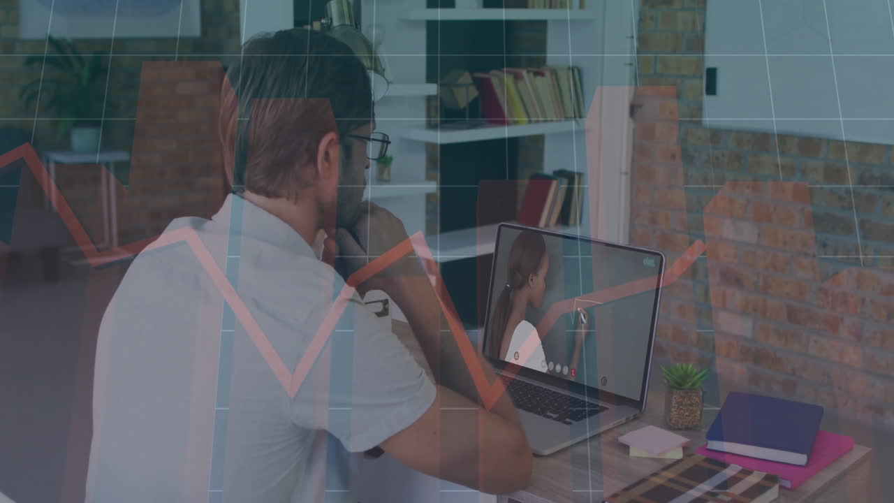 Man attending online education session on laptop in office with moving chalkboard diagrams floating