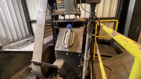 greasy rotating drive chain for a conveyor belt, machinery