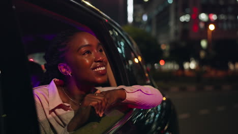 woman enjoying a car ride at night