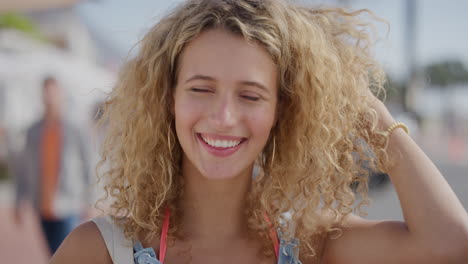 portrait of attractive blonde woman tourist running hand through hair smiling confident enjoying relaxed sunny day on summer vacation