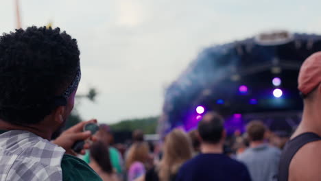 back view of the audience of a gig at a music festival