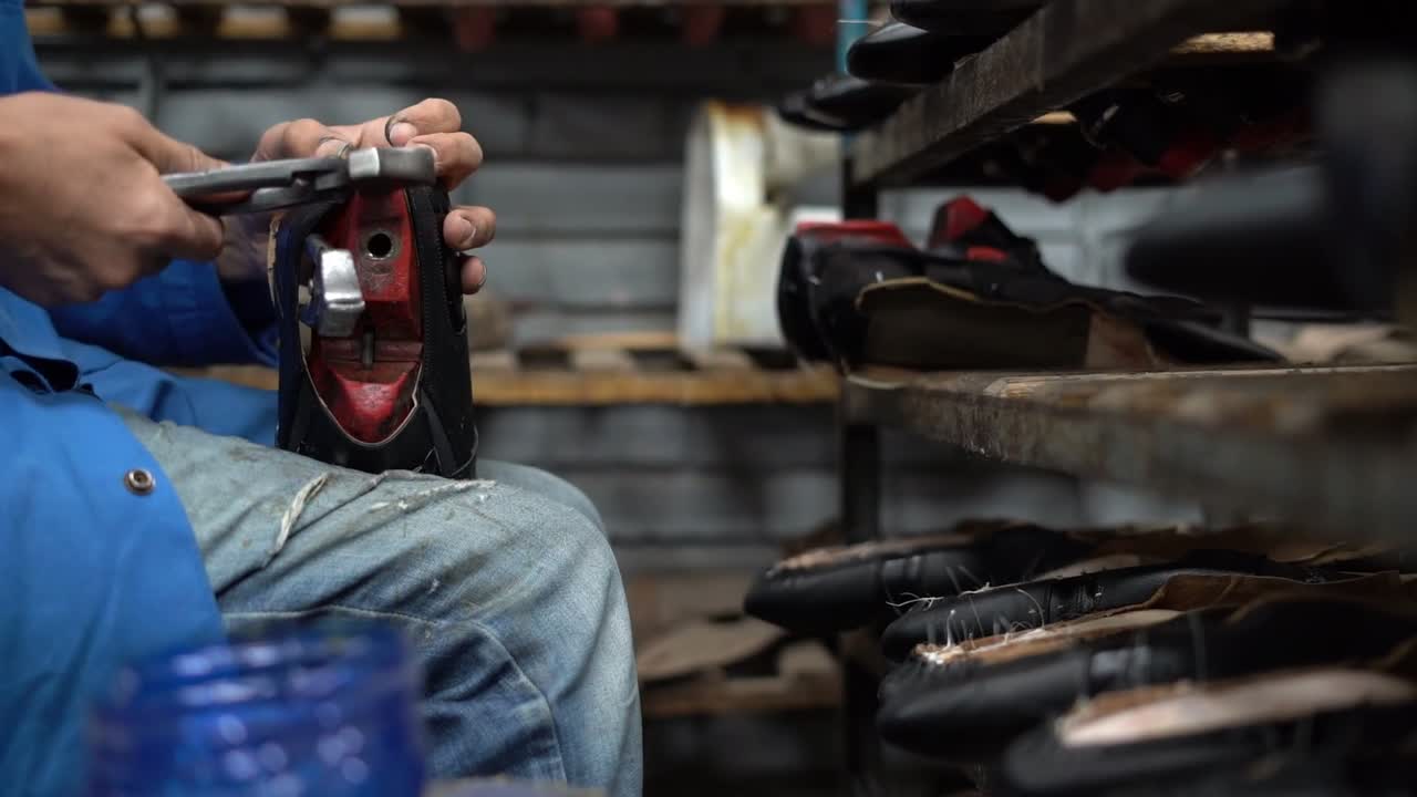 a craftsman handmade a shoe, close up shot, insert shot