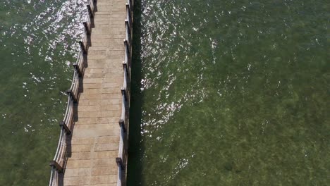 slow motion aerial of claver broadwalk in surigao del norte, philippines