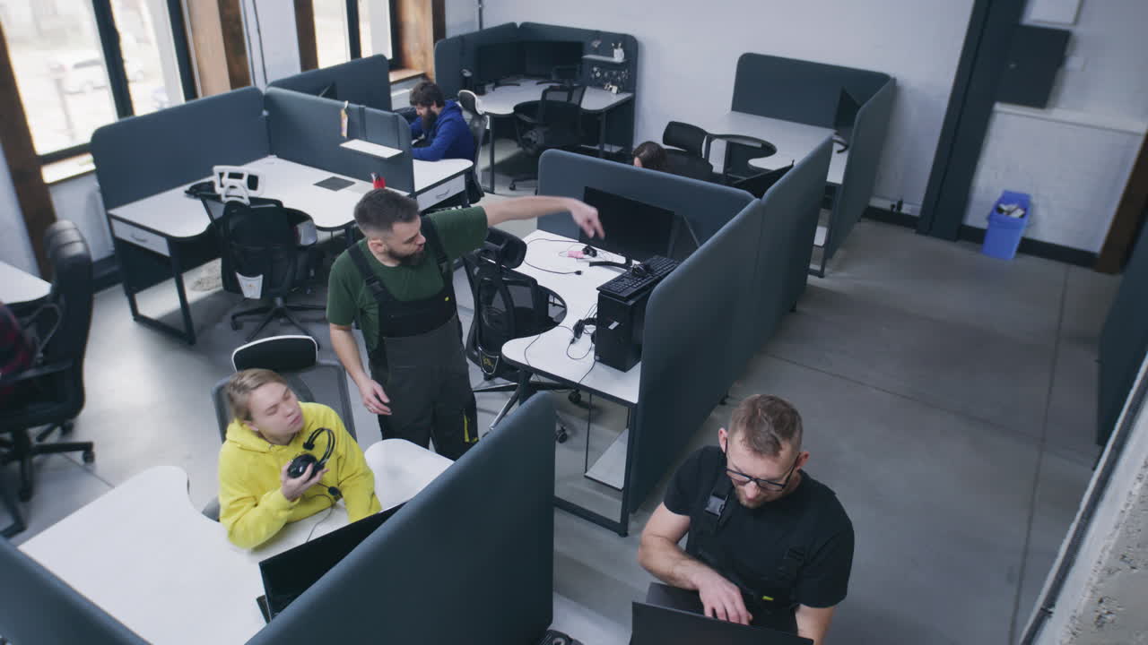 People working and collaborating in a modern open-plan office