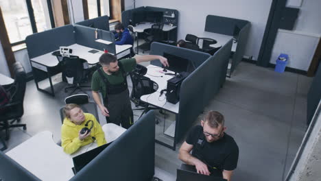 people working and collaborating in a modern open-plan office
