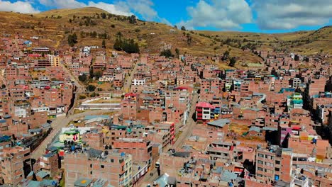 Drone-shot-of-Puno-region-Peru,-Peruvian-Andes,El-Altiplano,-native-Peruvian-town,-poorest-regions-in-Peru,-extreme-poverty