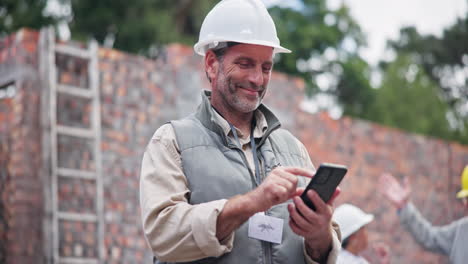 construction worker using smartphone on construction site
