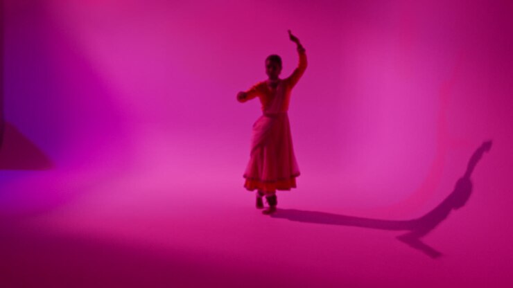 Camera Moves Through Studio Equipment To Show Female Kathak Dancer Wearing Traditional Indian Dress Dancing 2