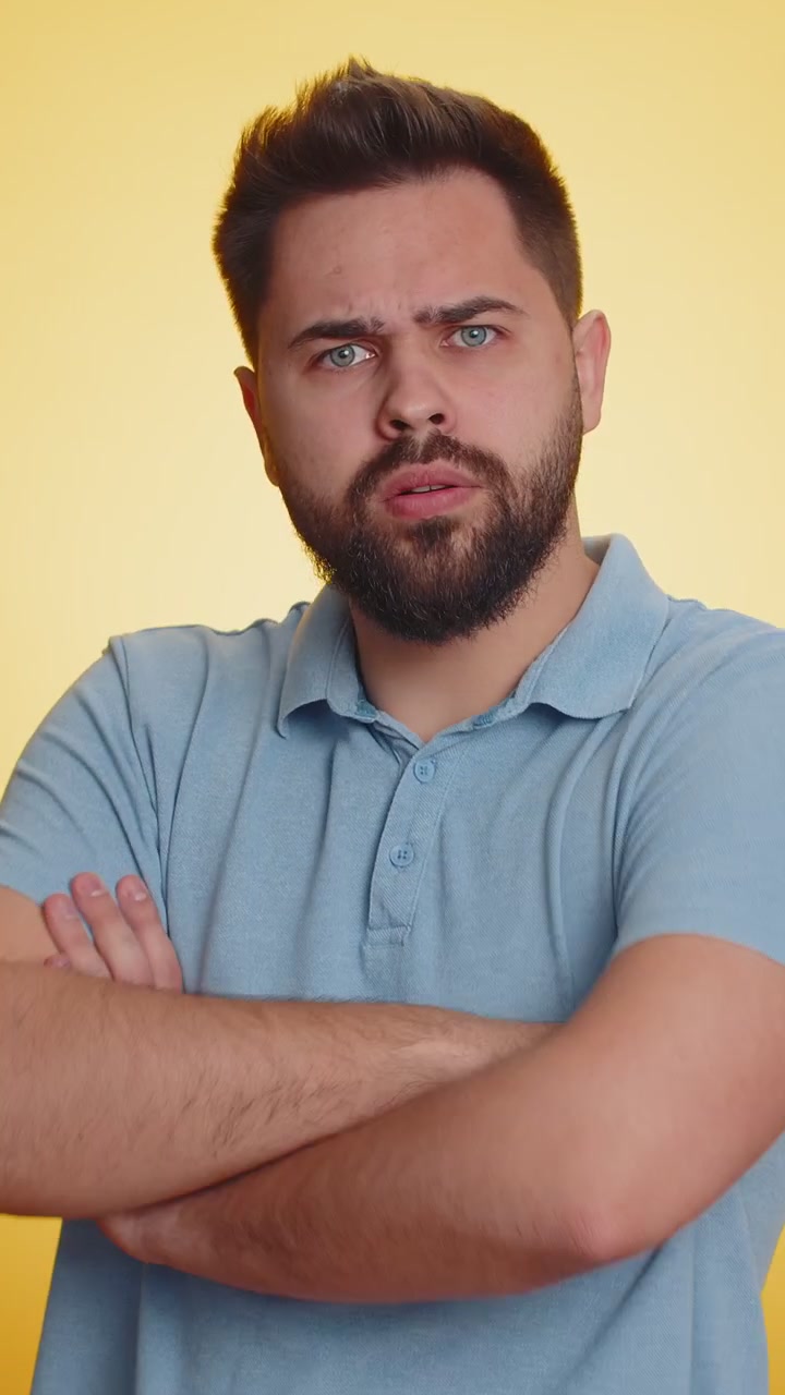 Cheerful funny bully caucasian man showing tongue making silly faces fooling around joking teasing