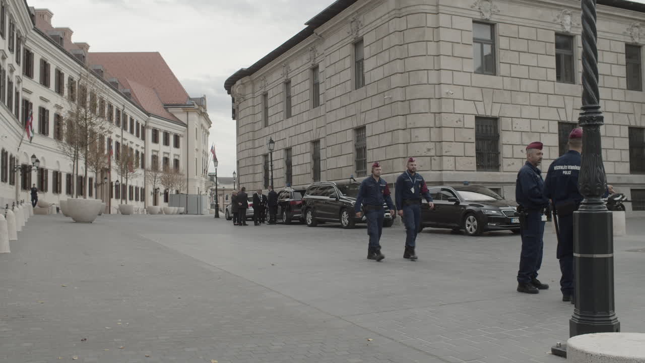 Hungarian police officers and security agents on guard outside the Former Honved High Command building for a joint press conference with Victor Orban and Marjan Sarec.