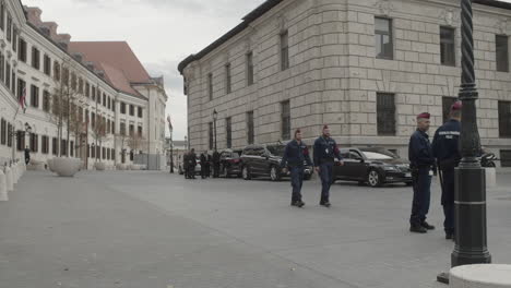 hungarian police officers and security agents on guard outside the former honved high command building for a joint press conference with victor orban and marjan sarec.