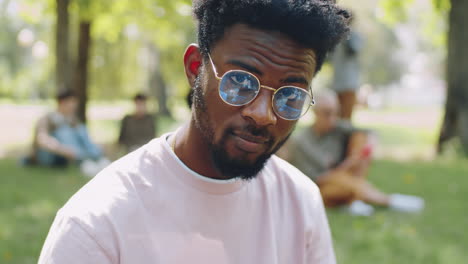 portrait of afro-american college student in park