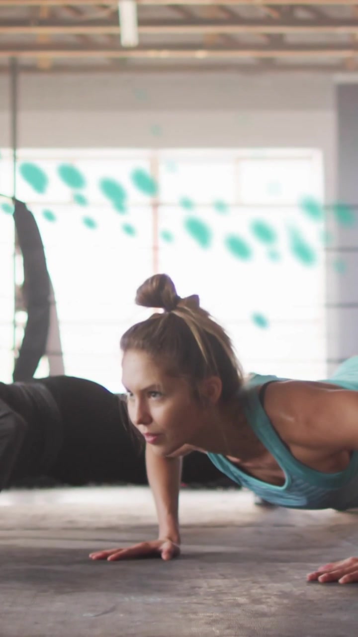Opening frame starting woman and partner doing pushups in sync for fitness as teal overlay tracing