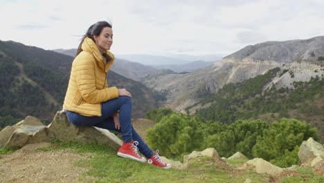 Calm-woman-looking-into-valley