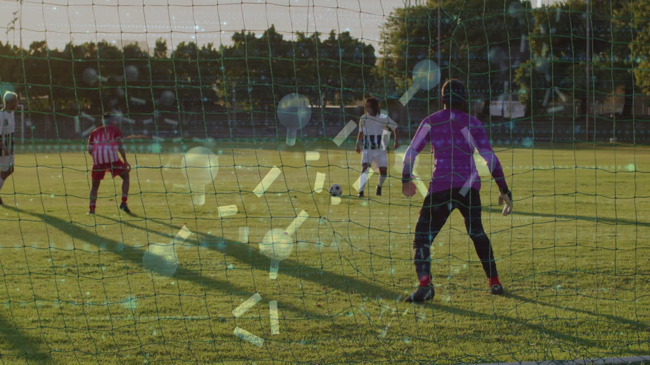 Kicking soccer ball towards goalkeeper, player with data animation on field