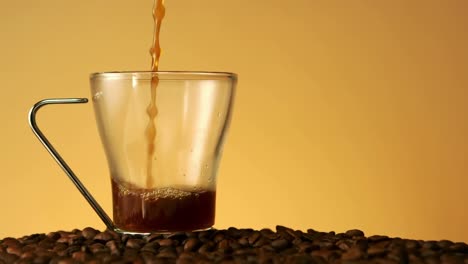 coffee pouring into a glass cup