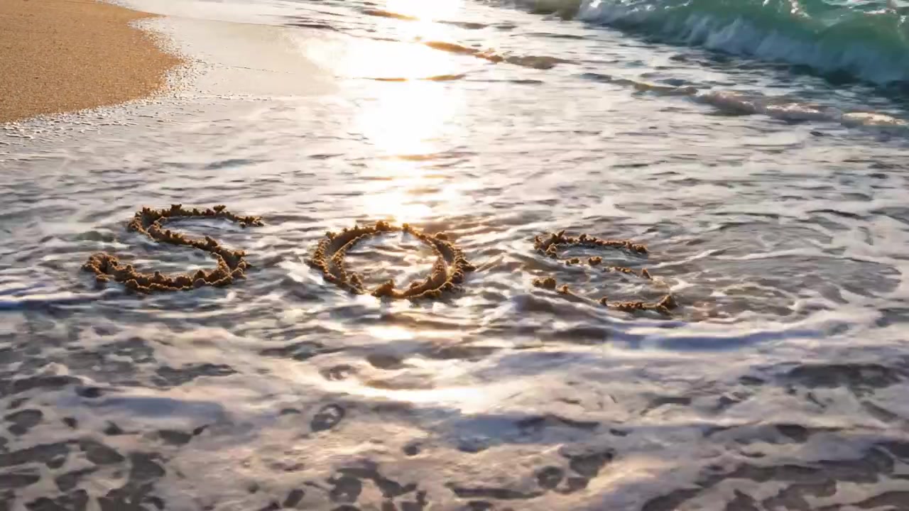 A Distressing Plea for Help: The Message 'SOS' Embedded in the Sand Near the Ocean Waves, Capturing Urgency and Hope Amidst Serene Beauty