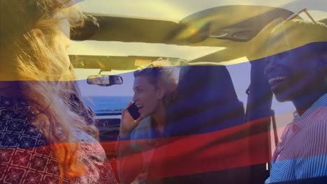 Animation-of-flag-of-colombia-over-diverse-group-of-friends-in-car