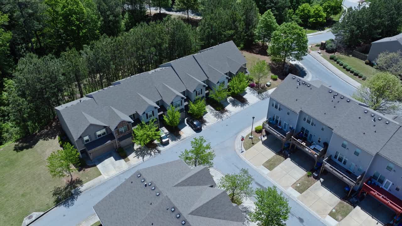 Modern row of houses or townhouses in suburb district of Atlanta, Georgia. Sunny day in summer. Quiet and peaceful suburb district in America